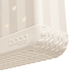 Close-up of a white inflatable pool with 'bogg' branding on a light gray background