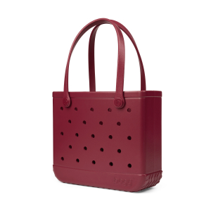 Maroon tote bag with black polka dots on a white background