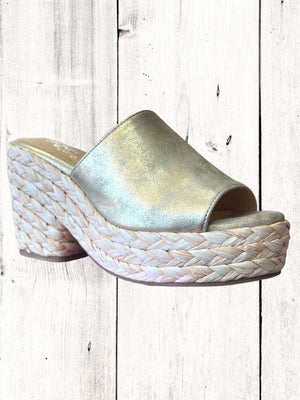 Hey Girl Solstice Heel sandal with side elastic detailing and a cushioned insole, displayed against a wooden background.