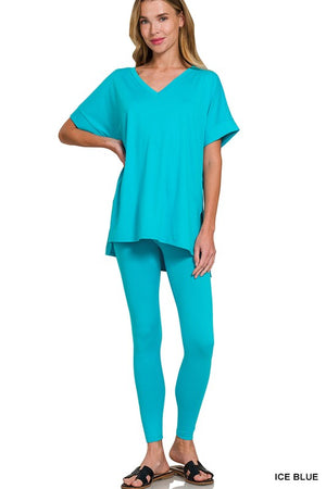 Woman wearing a turquoise outfit on a white background