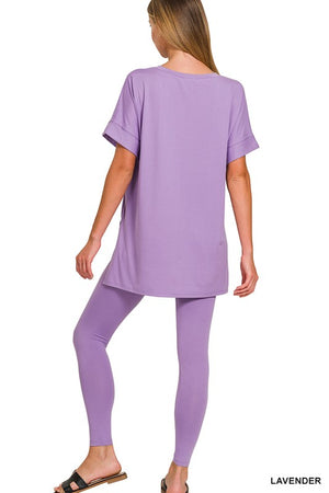 Woman wearing a lavender outfit on a white background