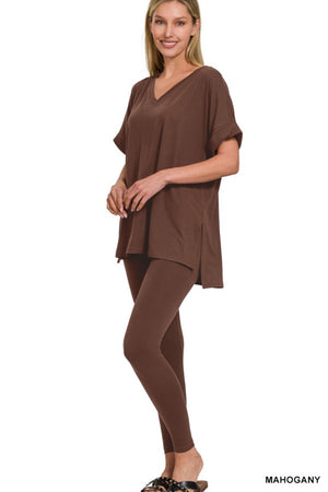 Woman wearing a brown outfit on a white background