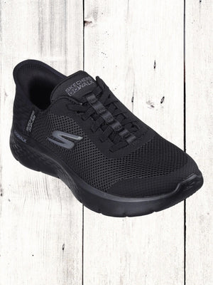 A black Skechers GO WALK Flex Grand Entry sneaker with mesh and synthetic upper, visible cushioning technology, and a lace-up closure.