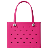 Pink tote bag with black polka dots and 'b' logo on a white background