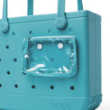 Teal bag with a clear pocket on a white background