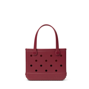 Maroon handbag with polka dot pattern on a white background