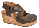 Brown wedge sandal with cork sole on a white background