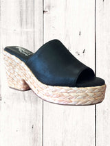 Hey Girl Solstice Heel sandal with side elastic detailing and a cushioned insole, displayed against a wooden background.