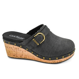 Black clog shoe with cork wedge sole on a white background