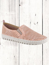 A navy perforated sneaker with a lightweight white sole, featuring twin gores for fit.