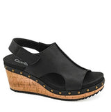 Black wedge sandal with cork sole on a white background