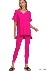Woman wearing a hot pink outfit on a white background