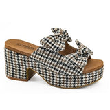 Houndstooth patterned sandal with a block heel on a white background