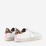 White sneakers with leopard print and pink accents on a white background