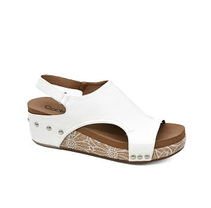 White sandal with brown accents on a white background